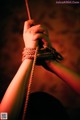 A person holding a rope in their hands. 