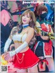 A woman in a red and white outfit posing for a picture.
