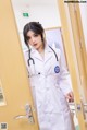 A woman in a white lab coat with a stethoscope.